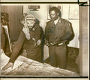 Yasser Arafat consulting the map as he conferred with Emmanuel Erskine - Vintage Photograph