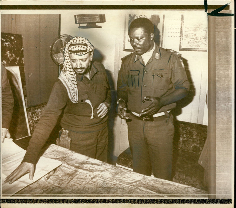 Yasser Arafat consulting the map as he conferred with Emmanuel Erskine - Vintage Photograph