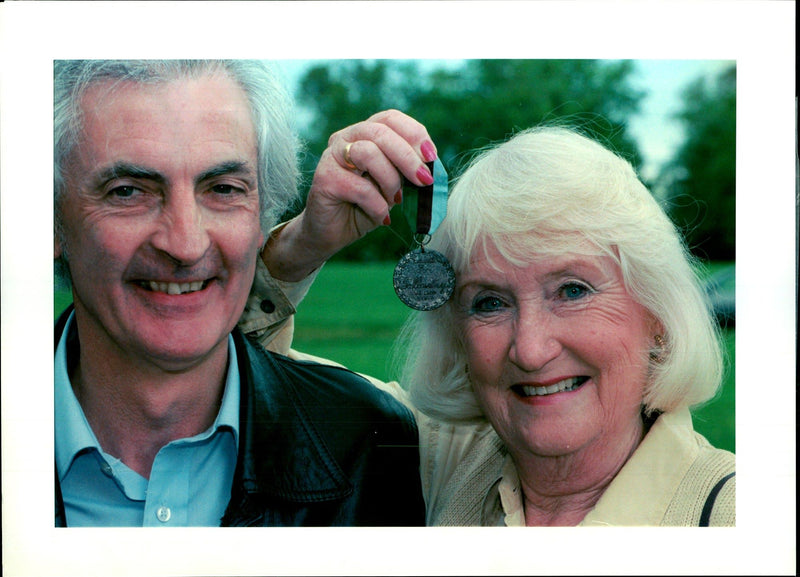 Mrs Maureen Bozdech holds the Animal "VS" which sold at Sothebys to Mr Garry Manley (back) - Vintage Photograph