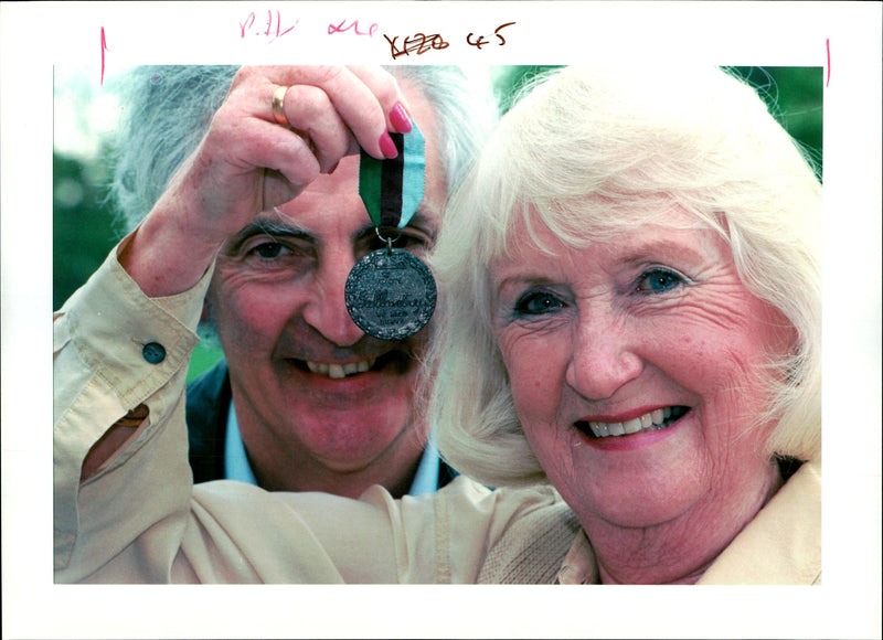 Mrs Maureen Bozdech holds the Animal "VS" which sold at Sothebys to Mr Garry Manley (back) - Vintage Photograph