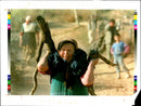 1995 ELDERLY WOMAN STRUGGLES WITH HEAVY LOAD FIREWOOD MAKI WRITER COUNTRY - Vintage Photograph