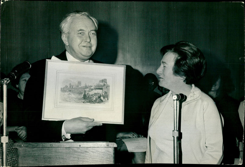 Prime Minister Harold Wilson with Millie Miller holding a Victorian lithograph - Vintage Photograph