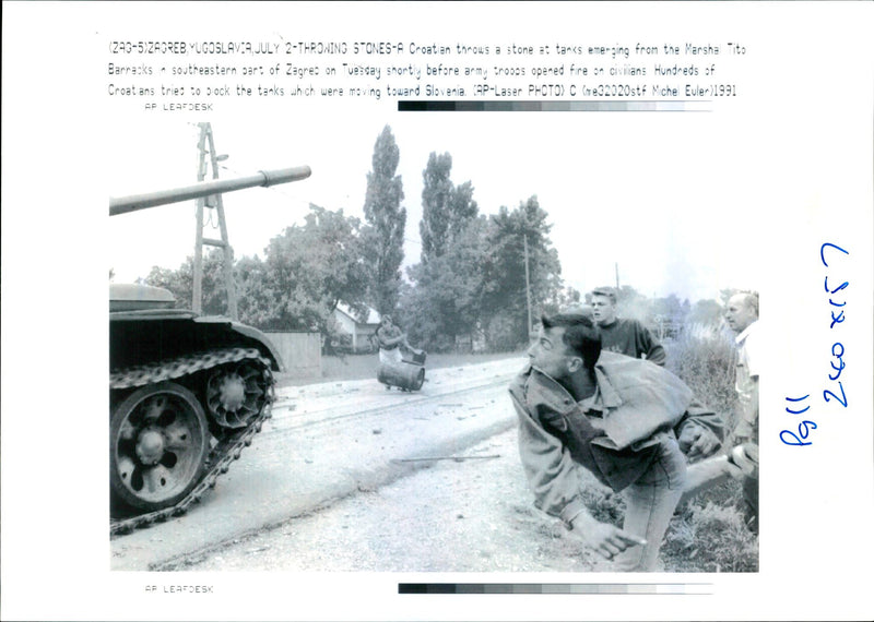 Croatian throws a stone at tank. - Vintage Photograph