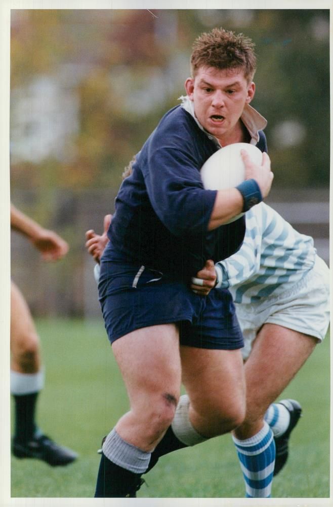 Nick Wood of St. Mary's Hospital breaks through the Cambridge Uni defence - Vintage Photograph
