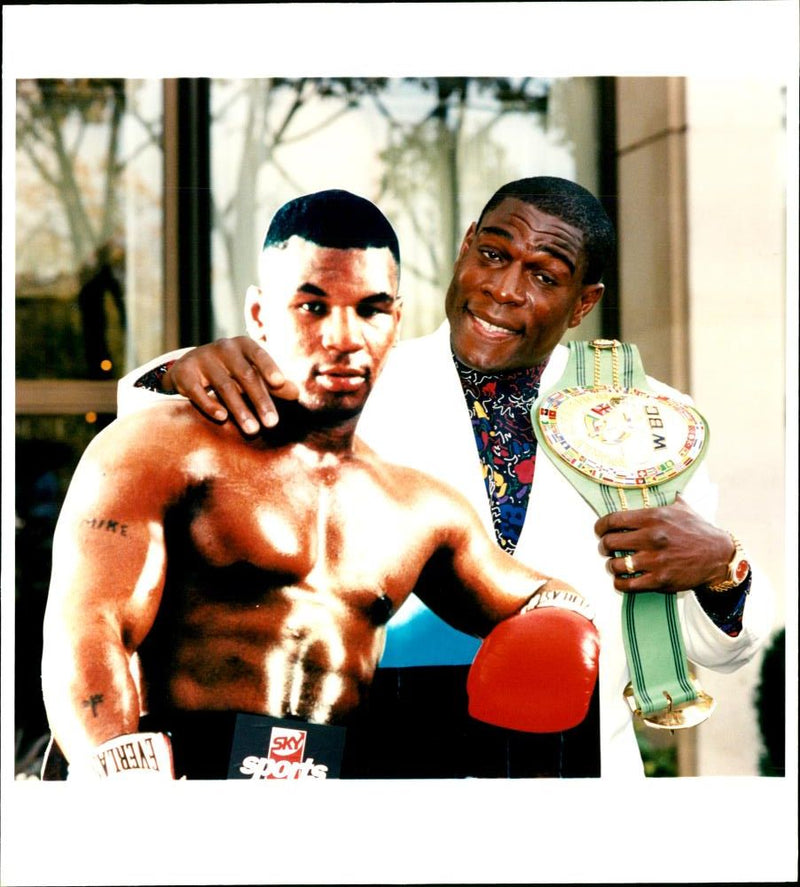 Frank Bruno poses with a cardboard cutout of Mike Tyson - Vintage Photograph