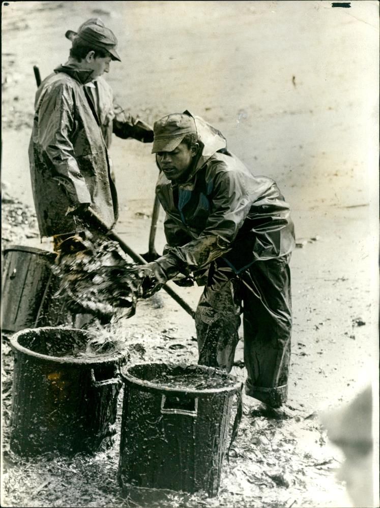 French troops burying engine oil leaked from tanker Olympic Bravery - Vintage Photograph