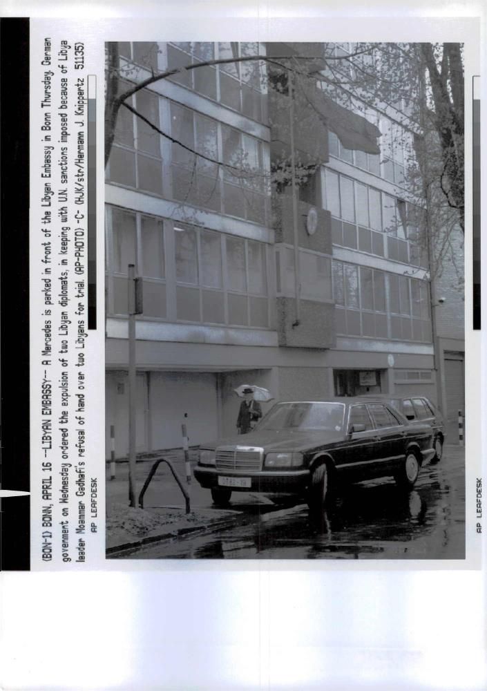 A Mercedes  is parked in front of the Libyan Embassy - Vintage Photograph