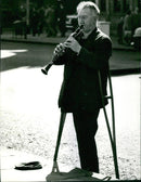 Street musician in London - Vintage Photograph