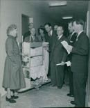 View of the inside of Hotell Malmen at Medborgarplatsen. Housewife Ally Wadelius shows the visitors the floors. - Vintage Photograph
