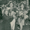 Graduate student Britta Carlsson carrying flowers - Vintage Photograph