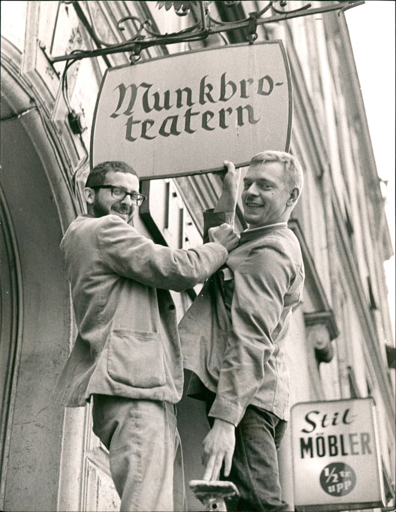 Pi Lind and Staffan Olzon take down the sign at the Pistol Theater - Vintage Photograph