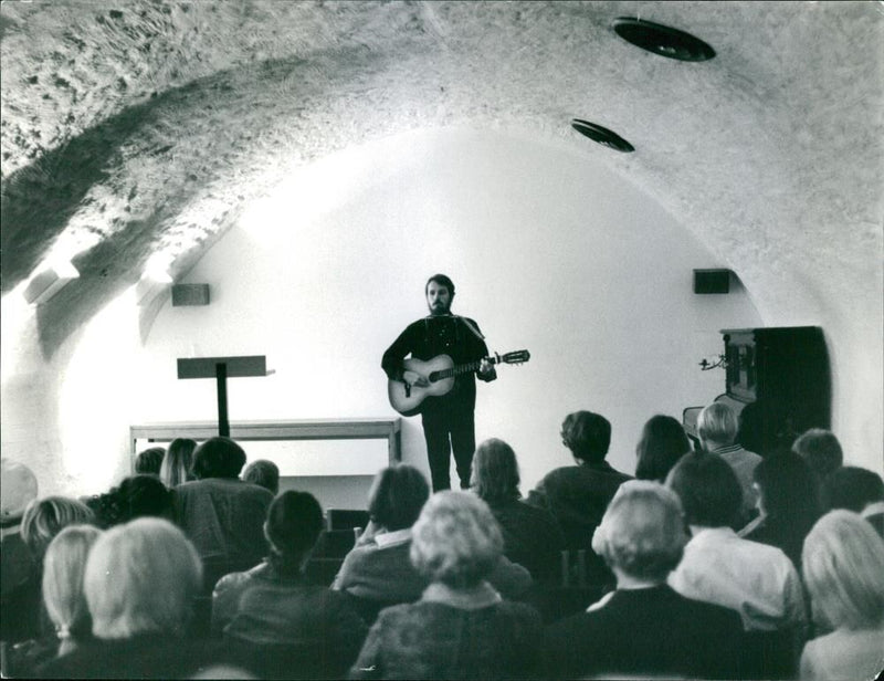 Folk music at the City Museum. Music student Martin STugart sings and plays - Vintage Photograph