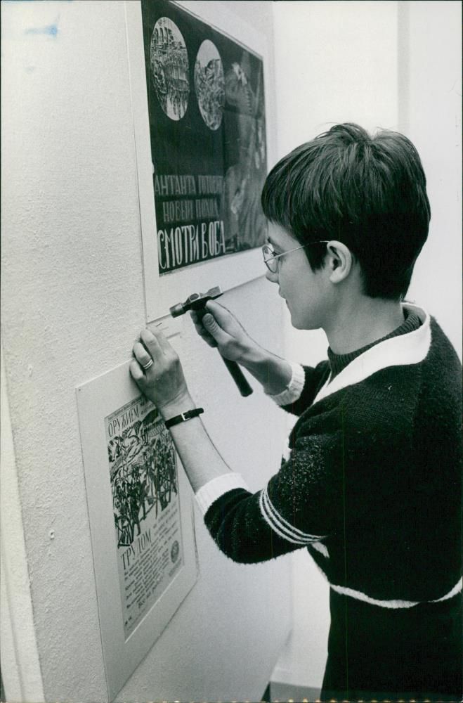 Vernissage at the City Museum. Amanuens Helena CederstrÃ¶m sets up posters - Vintage Photograph