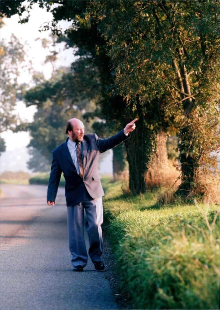 British writer Keith Skipper walks on the road - Vintage Photograph