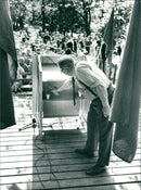 Swedish politician Gunnar Strang pouring drinks in the glass - Vintage Photograph