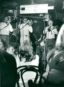 Musicians blowing instruments on stage at restaurant Stampen - Vintage Photograph