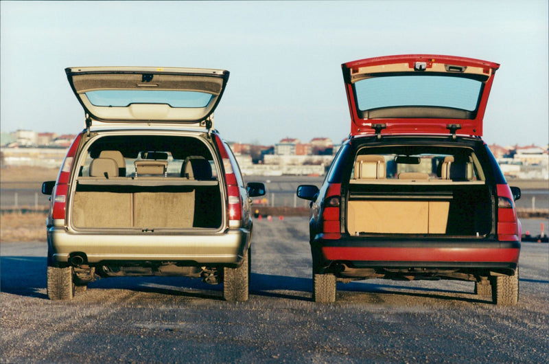 Luggage compartment is compared between the Volvo V70 and Saab 9 5 combi - Vintage Photograph