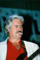 Rolf Wikstrom, Musician smoking and playing the guitar - Vintage Photograph