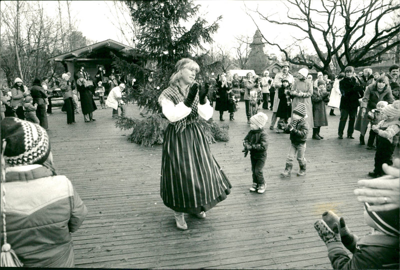 Skansens Christmas Market. Dance around the Christmas tree. Dance leader Monika Englund - Vintage Photograph