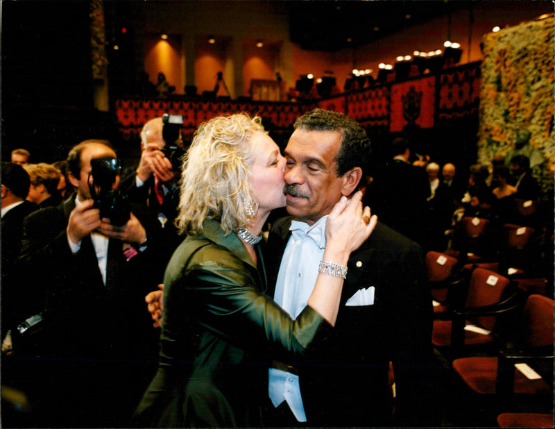 Nobel Prize Award Ceremony. Sigrid Nama congratulates her husband Derek Walcott after the award - Vintage Photograph