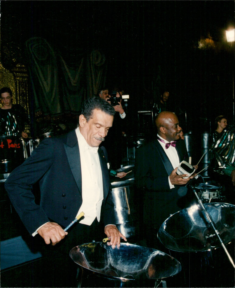 Nobel laureate in literature Derek Walcott plays on oil barrels during the festivities in the Blue Hall in Stadshuset - Vintage Photograph