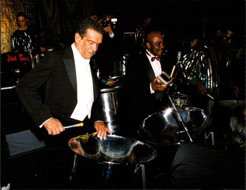 Nobel laureate in literature Derek Walcott plays on oil barrels during the festivities in the Blue Hall in Stadshuset - Vintage Photograph