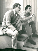 Swedish film director Bo Widerberg and Tommy Berggren speak about the upcoming movie - Vintage Photograph