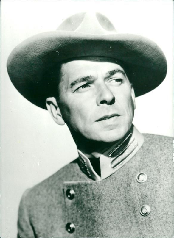 Actor and USA president Ronald Reagan in one of his former Wastern film roles. - Vintage Photograph