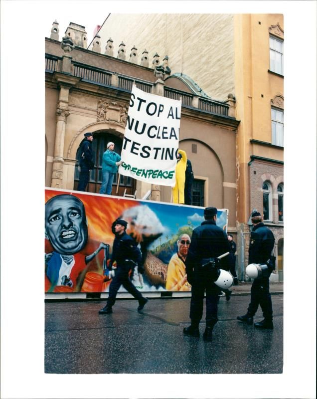 Greenpeace demonstrates and chains itself outside French embassy in protest against French nuclear weapons tests - Vintage Photograph