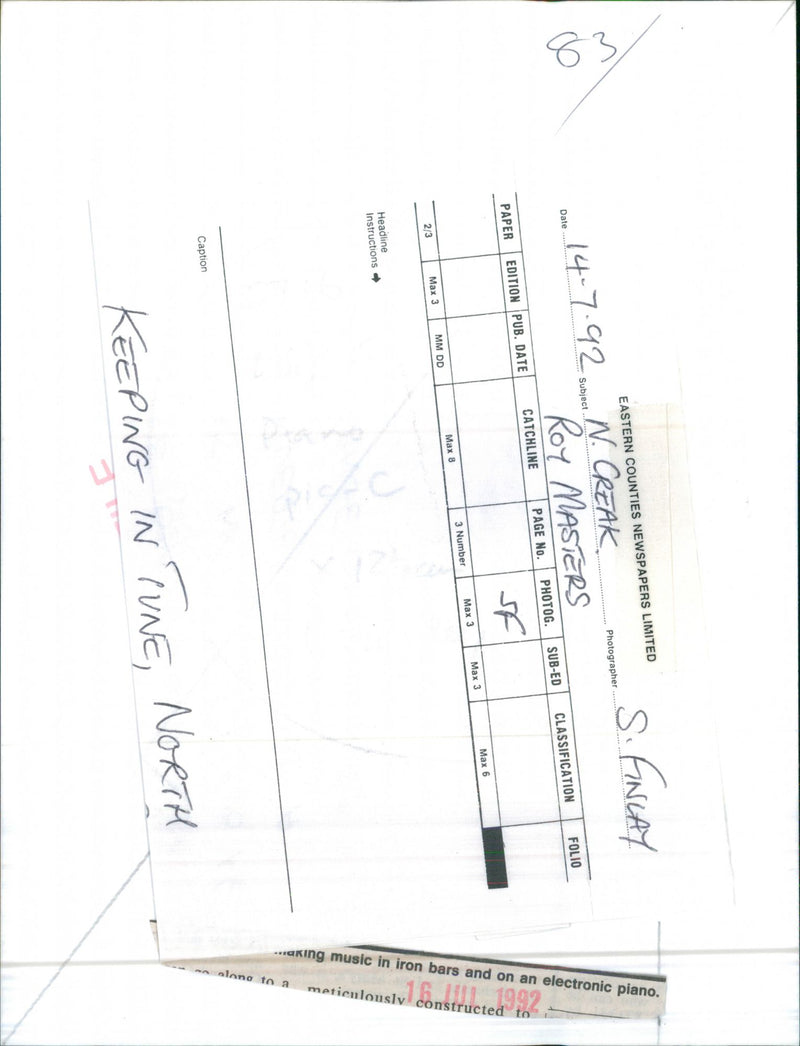 Roy Masters making music in iron bars and on an electronic piano - Vintage Photograph