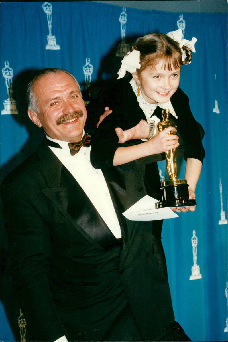 Russian filmmaker Nikita Mikhalkov with her daughter at the 1995 Oscar ceremony. - Vintage Photograph