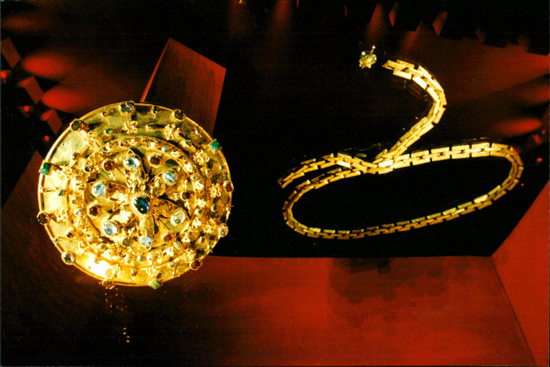 The buckle from the 13th century from Motala stream and the Leuhusenska chain from the 16th century is at Swedish people's gold room at Historical Museum. - Vintage Photograph