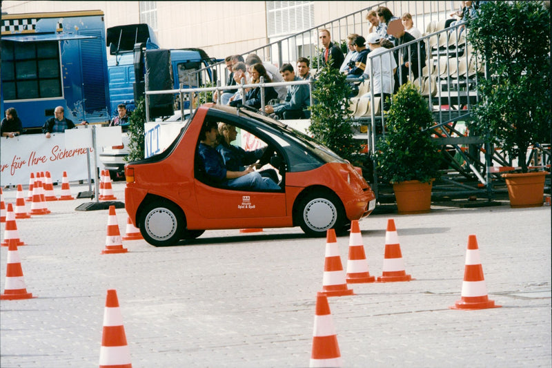 The cars. A tiny model is tried out at a security trail - Vintage Photograph