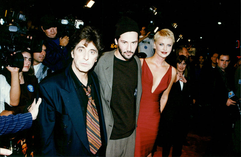 Al Pacino, Keanu Reeves and Charlize Theron at the premiere of the movie The Devil's Advocate - Vintage Photograph