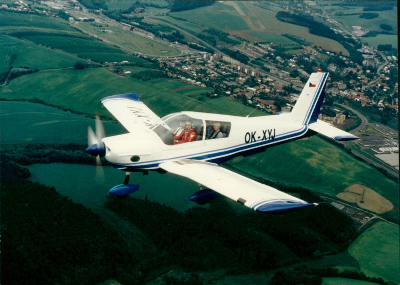 Zlin 143 L Is a 4 seater plane in the air - Vintage Photograph