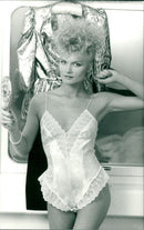 Model wearing a lace camisole romper - Vintage Photograph