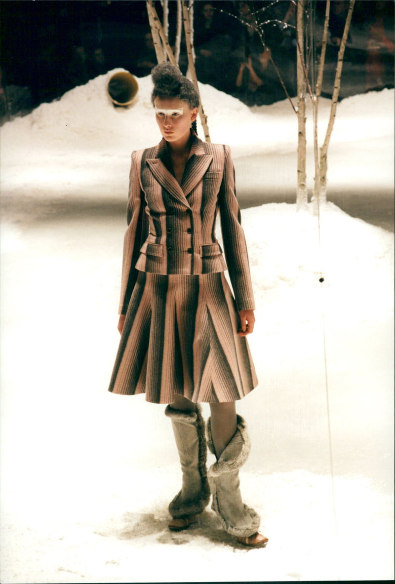 Favoring earth tones, McQueen sent his mannequins slogging across an artificial snowscape for London Fashion Week - Vintage Photograph