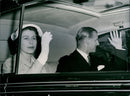 Queen Elizabeth and the Duke of Edinburgh waving to the crowds seeing them off as they drive out of Buckingham Palace - Vintage Photograph