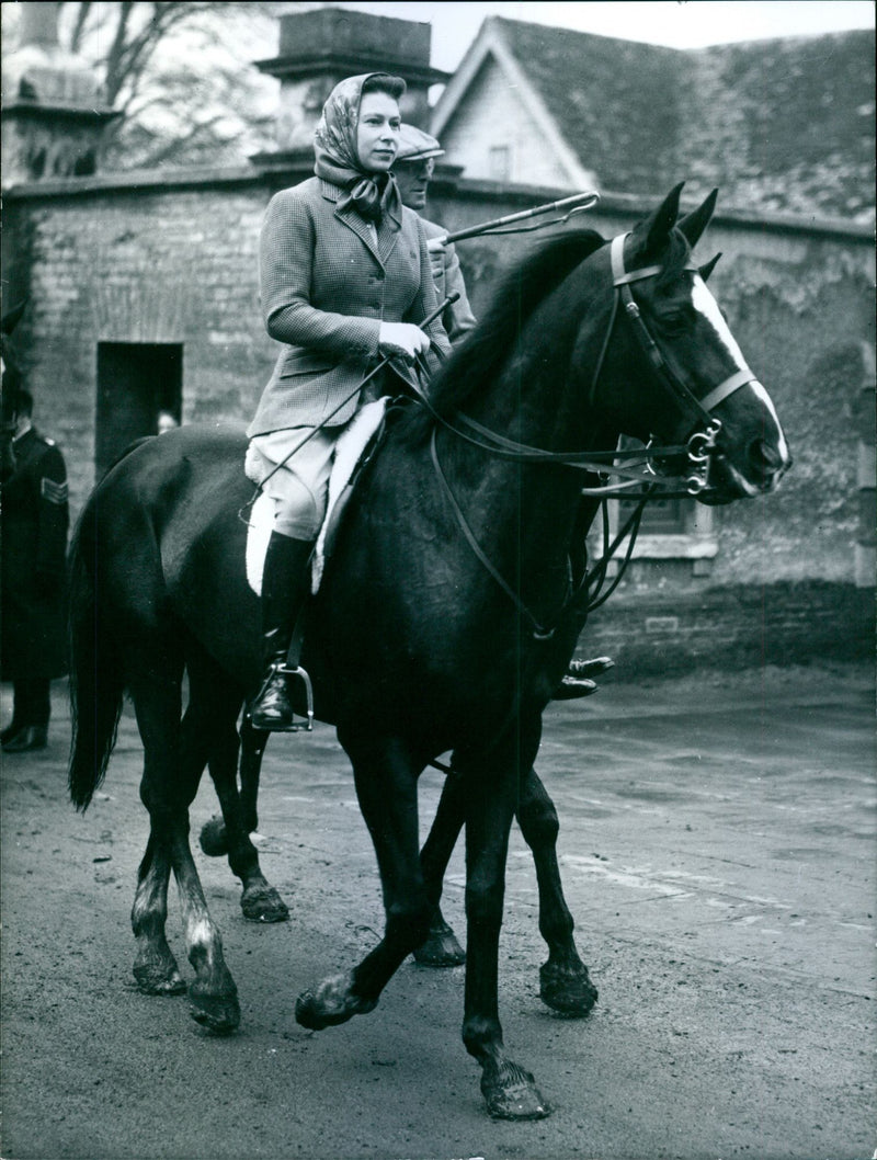 Queen Elizabeth II returns from a morning ride at Badminton, Gloucestershire accompanied by the Duke of Beauford - Vintage Photograph