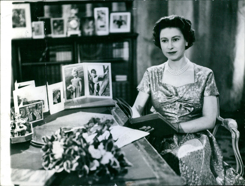 Queen Elizabeth II reading Bunyan in her traditional Christmas broadcast to the people - Vintage Photograph
