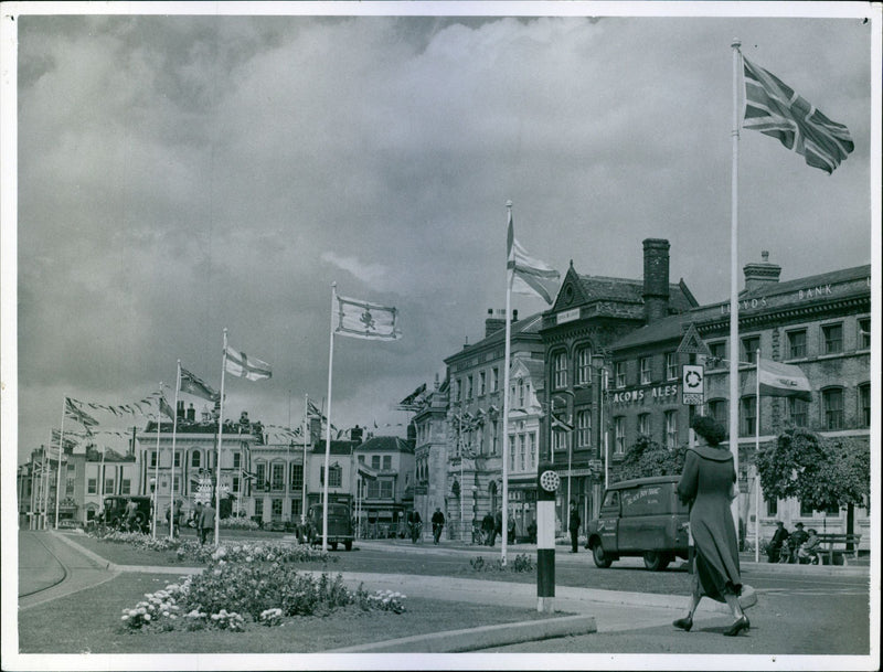 The coronation of Queen Elizabeth II. Street view of flags in Great Yarmouth at Hall Quay for the coronation - Vintage Photograph