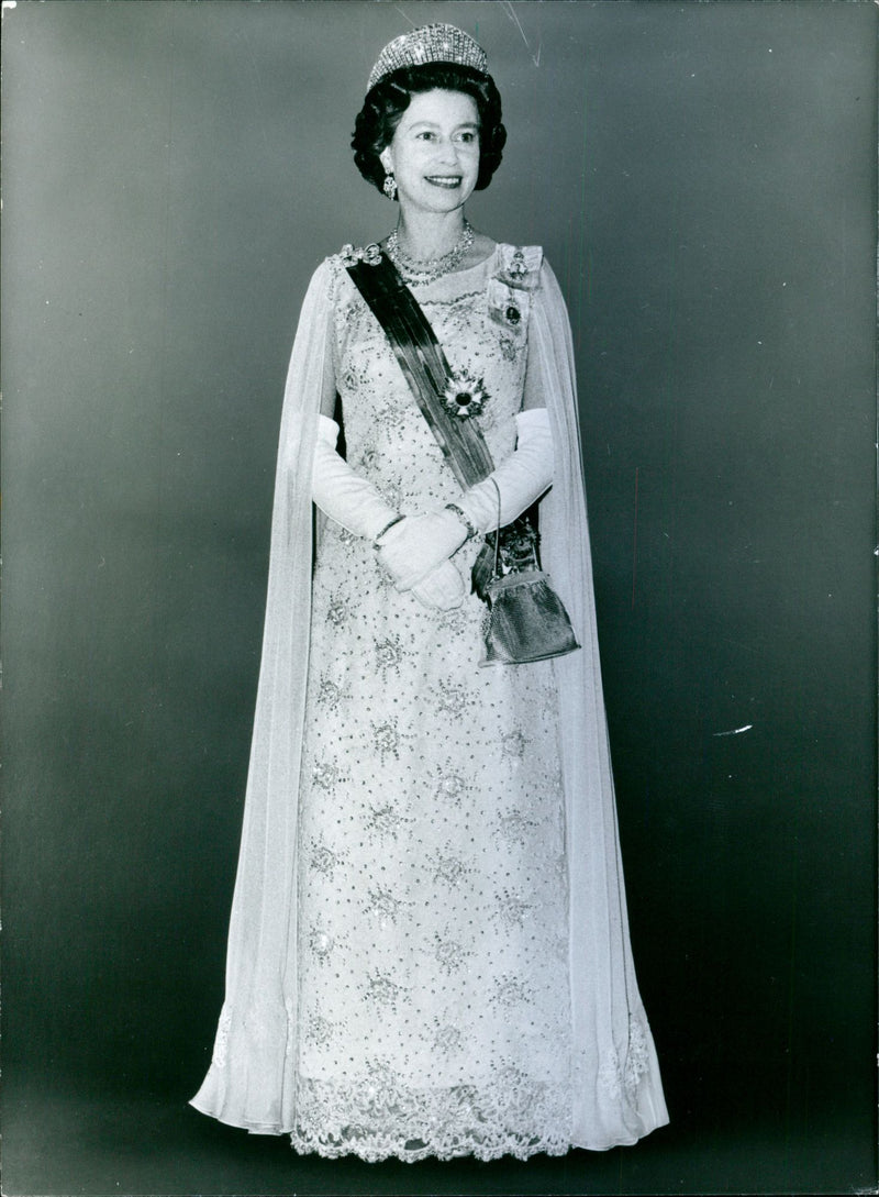 Queen Elizabeth II attending to the banquet given by Queen Juliana and Prince Bernhard of the Netherlands during their visit in London 1972 - Vintage Photograph