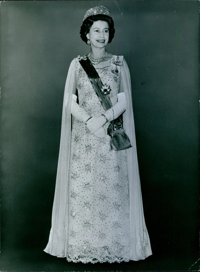 Queen Elizabeth II attending to the banquet given by Queen Juliana and Prince Bernhard of the Netherlands during their visit in London 1972 - Vintage Photograph