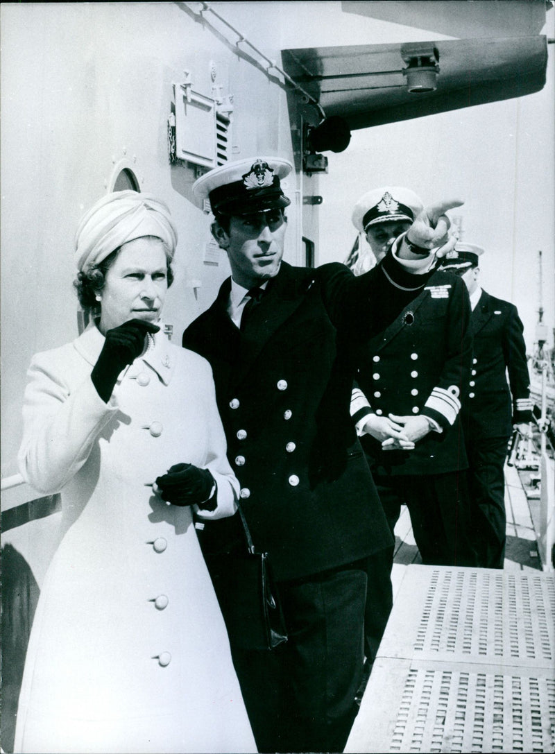 Queen Elizabeth II visits HMS Norfolk at Portsmouth Sub-Lieutenant Prince Charles one of the ships officers acts as guide - Vintage Photograph