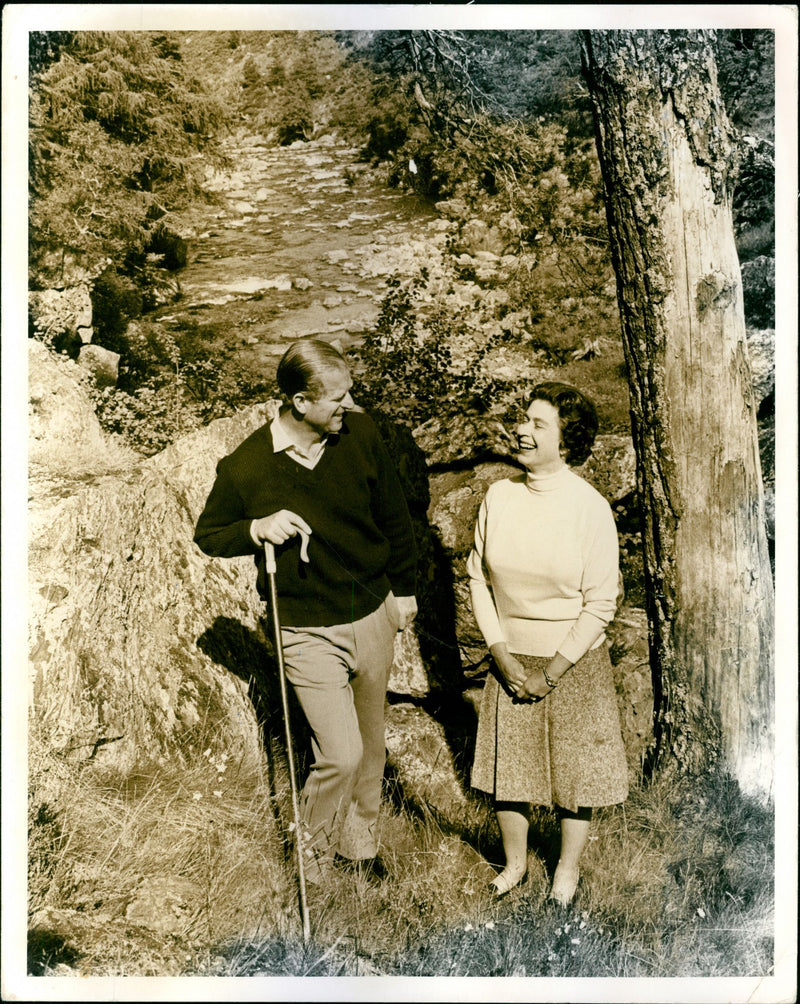 Queen Elizabeth II and Duke of Edinburgh during a walk on the Balmoral Estate. Picture taken in connection with the celebration of their Silver Wedding - Vintage Photograph
