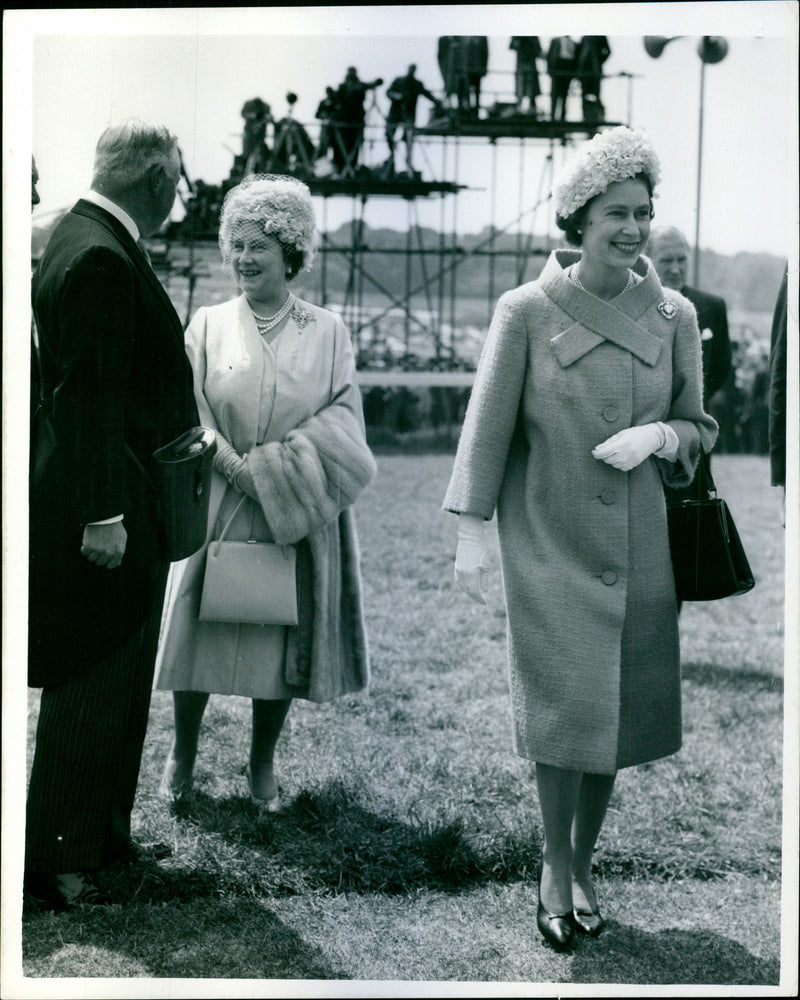 The Duke of Norfolk chats to The Queen Mother as her Majesty Queen Elizabeth II walks across the course on their arrival at Epsom - Vintage Photograph