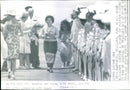 Queen Elizabeth admires a boquet of flowers handed to her on arrival in Thailand - Vintage Photograph