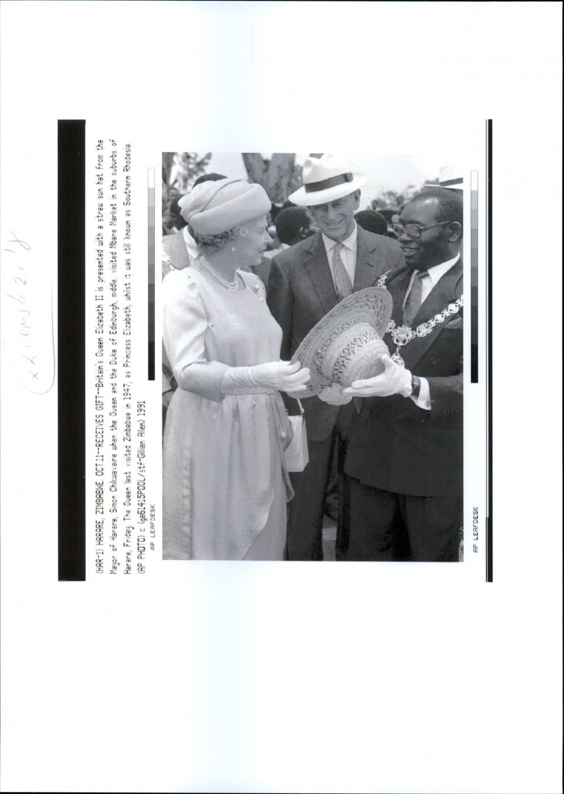 Queen Elizabeth II, Prince Philip and Simon Chikwavaire at Mbare Market - Vintage Photograph