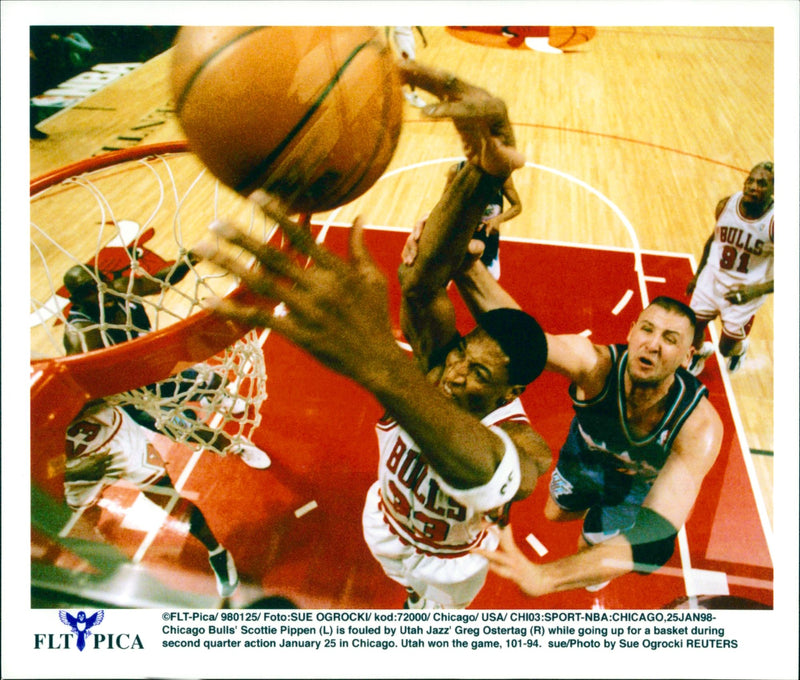 Chicago Bulls' Scottie Pippen (L) is fouled by Utah Jazz' Greg Ostertag (R). - Vintage Photograph