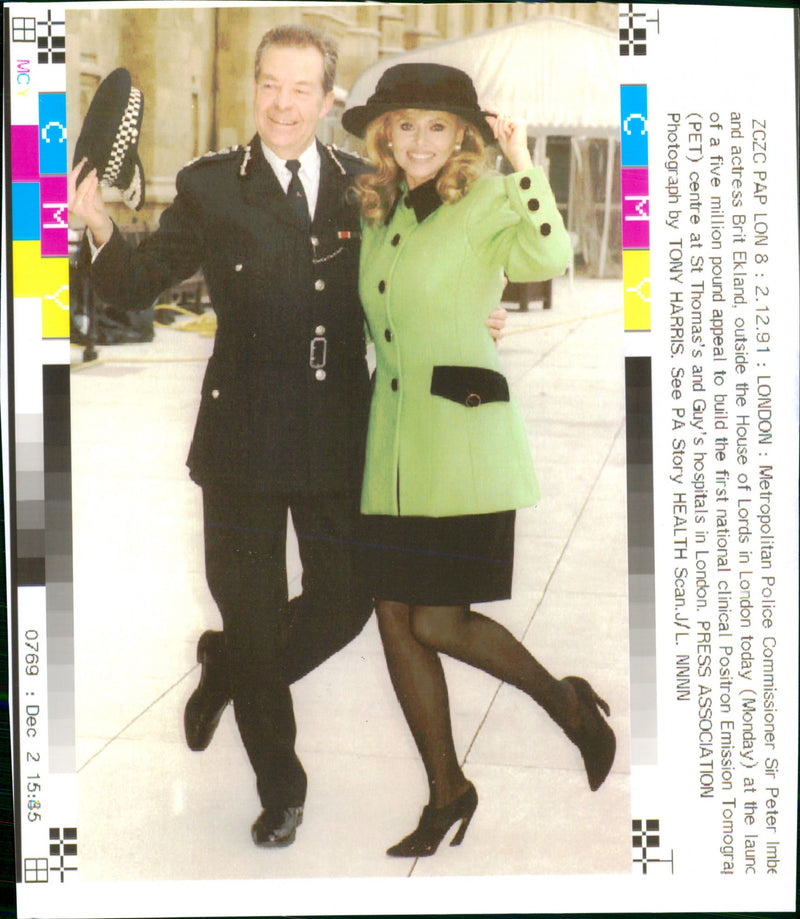 Metropolitan Police Commissioner Sir Peter Imbert and actress Britt Ekland outside the House of Lords in London - Vintage Photograph